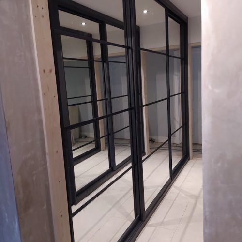 Mirrored sliding wardrobes by Fusion Robes