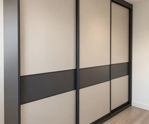 Contemporary sliding wardrobe doors with cream panels, charcoal horizontal feature bands and dark frames.