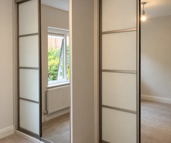 Mirror and glass stepped back sliding wardrobes